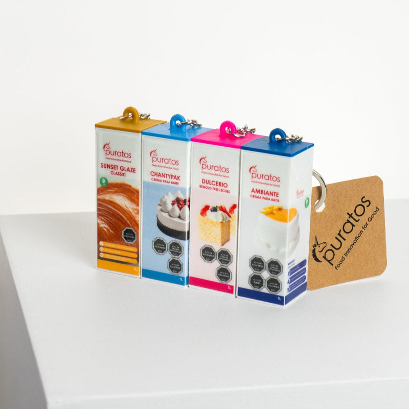 Set de llaveros publicitarios personalizados de Puratos, fabricados en impresión 3D, con distintos diseños, relieves definidos y alta fidelidad de color